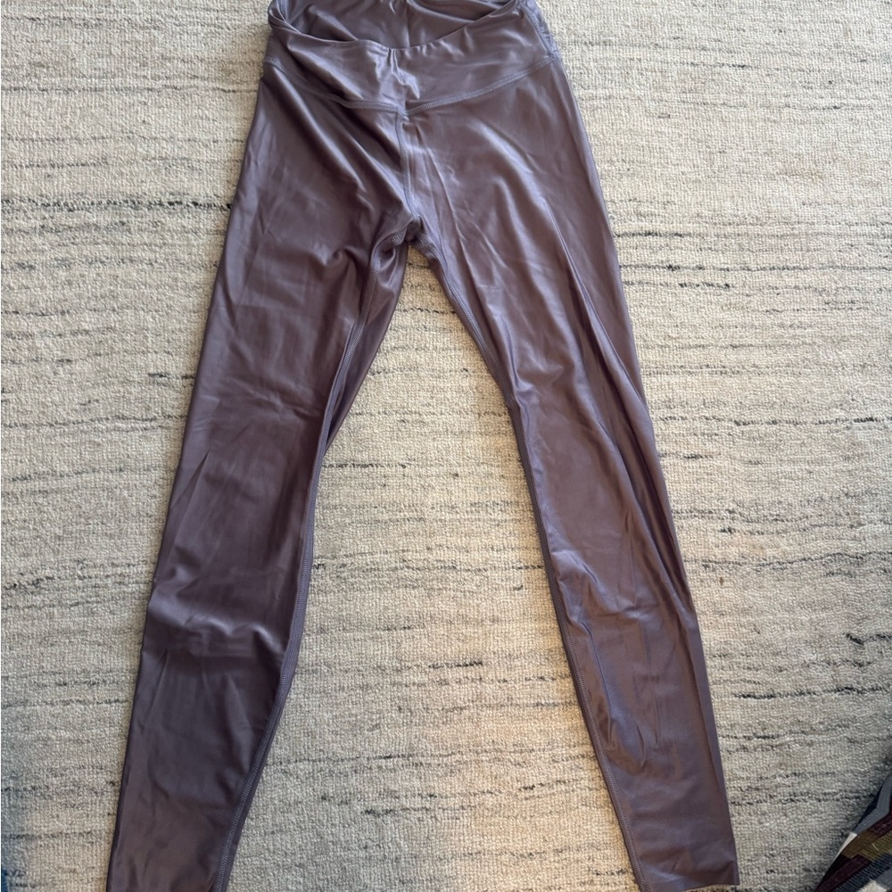 Sleek metallic purple leggings